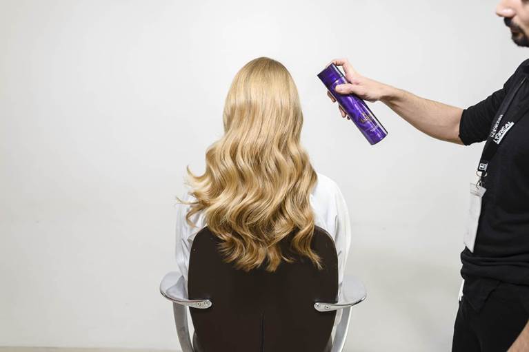 Spray through a hairspray to keep the curls in place